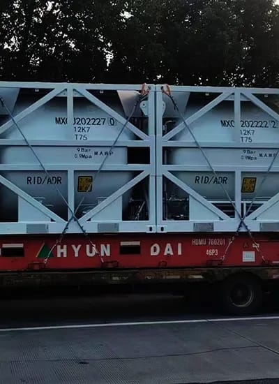 Cryogenic tank containers loaded and ready for delivery at an industrial storage facility