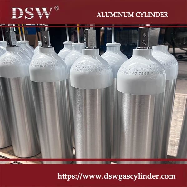 Aluminum gas cylinders in various sizes arranged for industrial and commercial use