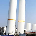 Industrial gas supply system with cryogenic storage tanks for factory gas distribution