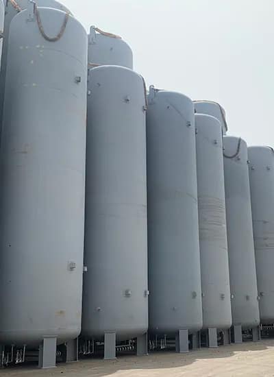 Large industrial cryogenic tanks used for storing liquefied gases such as nitrogen, oxygen, or LNG